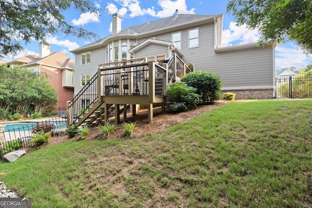 979 Pathview Ct, Dacula, GA 30019 - rear view of house with stairs, a deck, and a chimney
