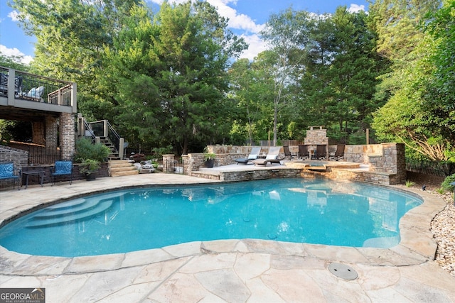 979 Pathview Ct, Dacula, GA 30019 - view of pool featuring stairway, a patio area, a fireplace, and view of scattered trees
