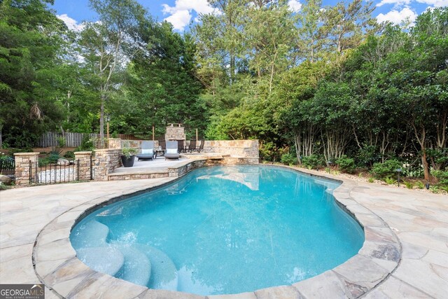 979 Pathview Ct, Dacula, GA 30019 - view of pool with a patio area and view of scattered trees