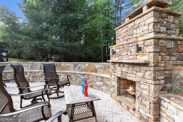 979 Pathview Ct, Dacula, GA 30019 - view of patio featuring an outdoor stone fireplace
