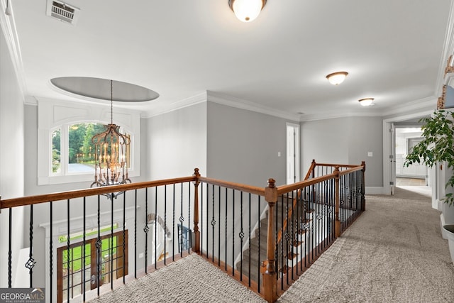 979 Pathview Ct, Dacula, GA 30019 - hall with a chandelier, crown molding, carpet flooring, an upstairs landing, and baseboards