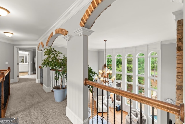 979 Pathview Ct, Dacula, GA 30019 - hall with a chandelier, carpet floors, decorative columns, baseboards, and crown molding