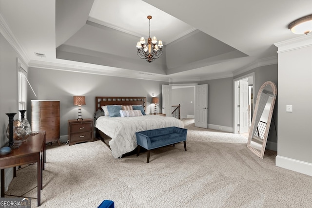 979 Pathview Ct, Dacula, GA 30019 - carpeted bedroom featuring crown molding, a chandelier, a tray ceiling, and baseboards