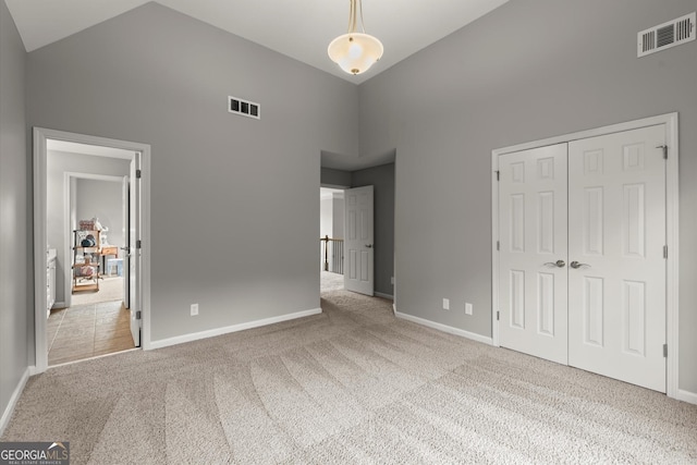 979 Pathview Ct, Dacula, GA 30019 - unfurnished bedroom featuring high vaulted ceiling, carpet, baseboards, and a closet