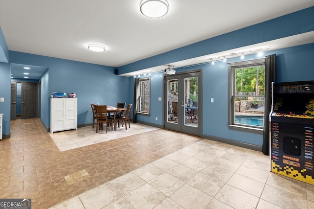 979 Pathview Ct, Dacula, GA 30019 - dining space featuring french doors, baseboards, and track lighting