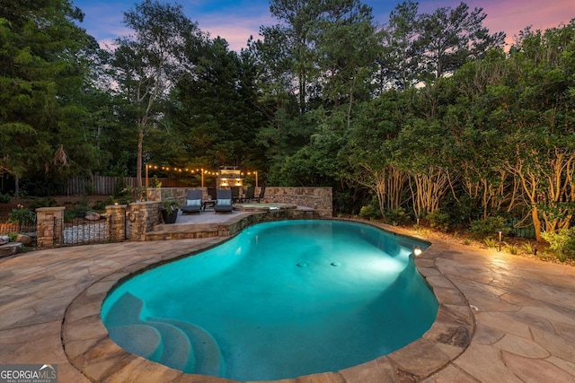 979 Pathview Ct, Dacula, GA 30019 - view of swimming pool with a patio and view of wooded area