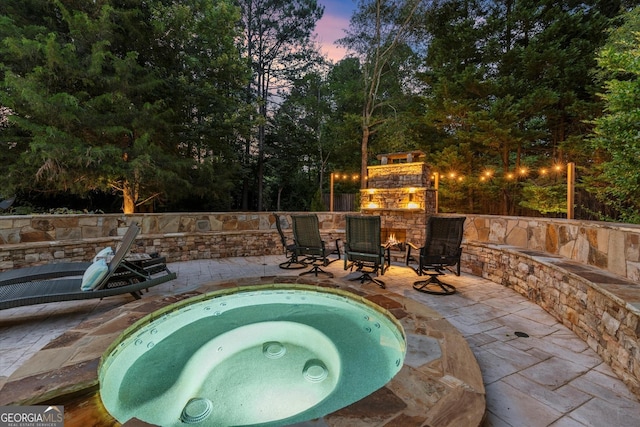 979 Pathview Ct, Dacula, GA 30019 - view of swimming pool featuring a patio, an outdoor hot tub, and an outdoor stone fireplace