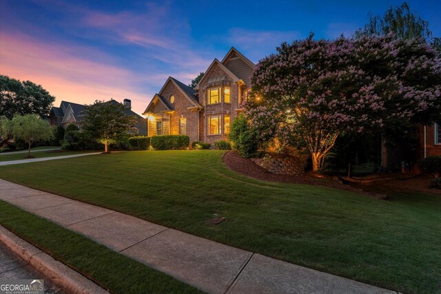 979 Pathview Ct, Dacula, GA 30019 - traditional home with a lawn and brick siding