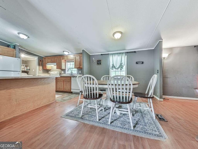 108 Casual Ridge Run, Jasper, GA 30143 - dining area featuring light wood finished floors, baseboards, and crown molding