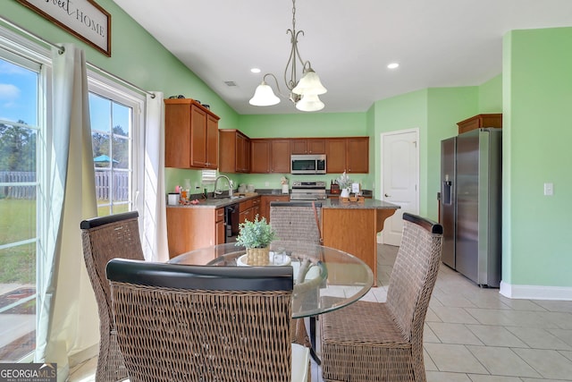 17 Sagefield Dr, Ellabell, GA 31308 - kitchen with stainless steel appliances, a chandelier, a center island, baseboards, and recessed lighting