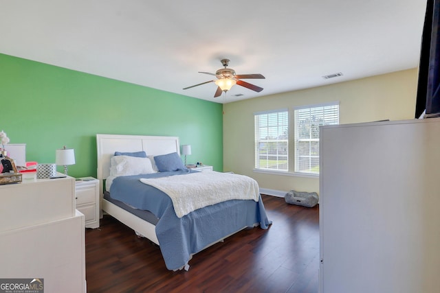 17 Sagefield Dr, Ellabell, GA 31308 - bedroom featuring dark wood-style flooring, a ceiling fan, and baseboards