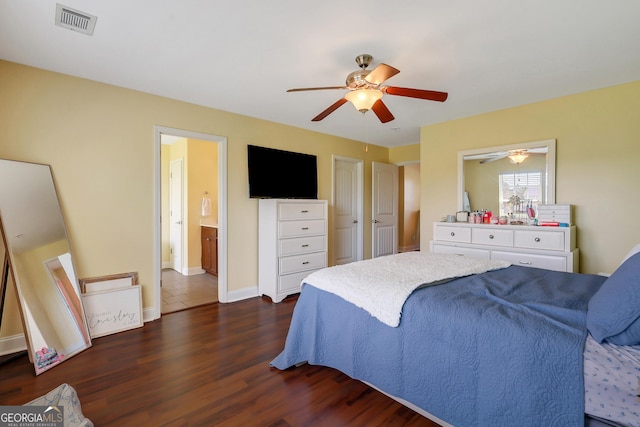 17 Sagefield Dr, Ellabell, GA 31308 - bedroom featuring dark wood-type flooring, a ceiling fan, ensuite bath, and baseboards