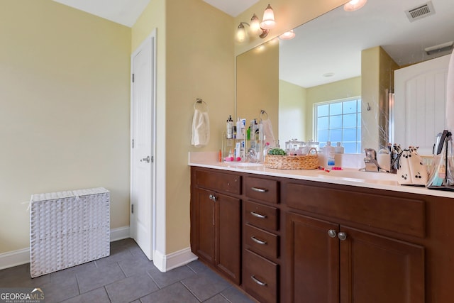 17 Sagefield Dr, Ellabell, GA 31308 - bathroom with double vanity, tile patterned flooring, and baseboards