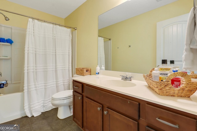 17 Sagefield Dr, Ellabell, GA 31308 - bathroom with vanity, tile patterned flooring, toilet, and shower / bath combo with shower curtain