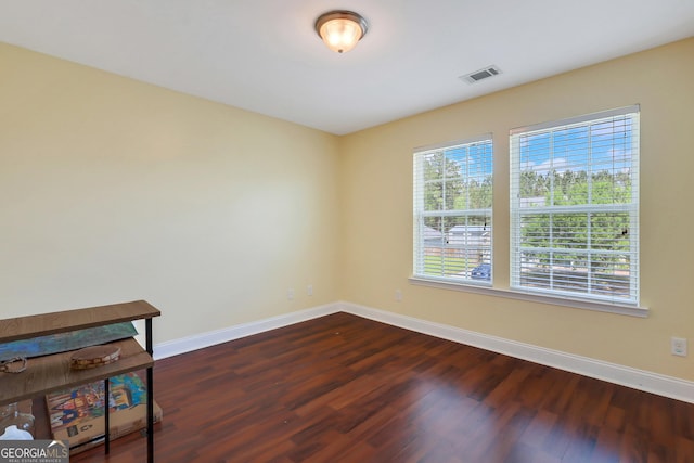 17 Sagefield Dr, Ellabell, GA 31308 - unfurnished room featuring baseboards and dark wood finished floors