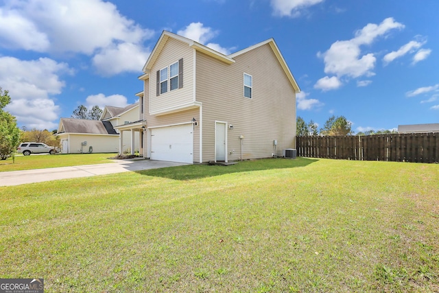 17 Sagefield Dr, Ellabell, GA 31308 - view of side of home with a garage, driveway, and central AC