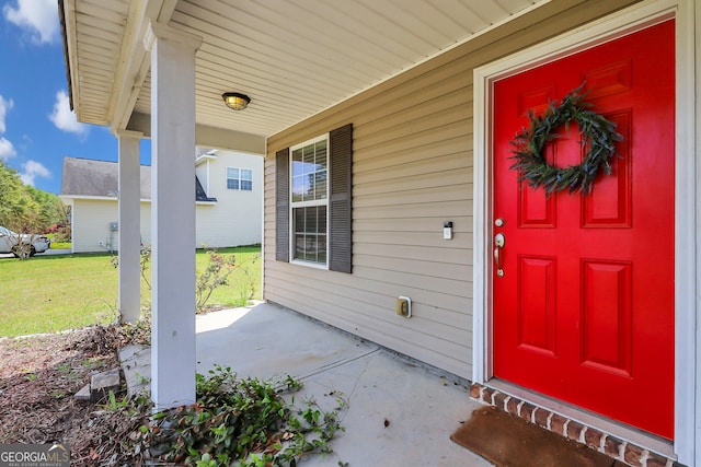 17 Sagefield Dr, Ellabell, GA 31308 - view of exterior entry with a porch and a yard
