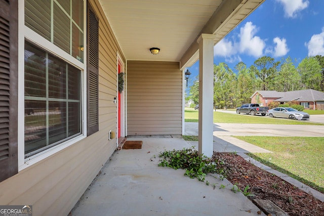 17 Sagefield Dr, Ellabell, GA 31308 - covered porch featuring a yard