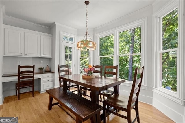 1860 Hill Chase, Alpharetta, GA 30022 - dining area featuring a chandelier, light wood-style floors, crown molding, and baseboards