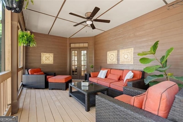 1860 Hill Chase, Alpharetta, GA 30022 - living area with french doors, light wood finished floors, wood walls, and a ceiling fan