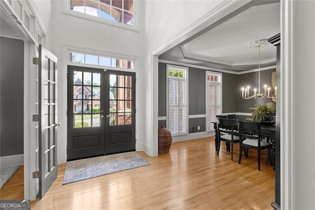 1860 Hill Chase, Alpharetta, GA 30022 - foyer with french doors, a chandelier, ornamental molding, healthy amount of natural light, and wood finished floors