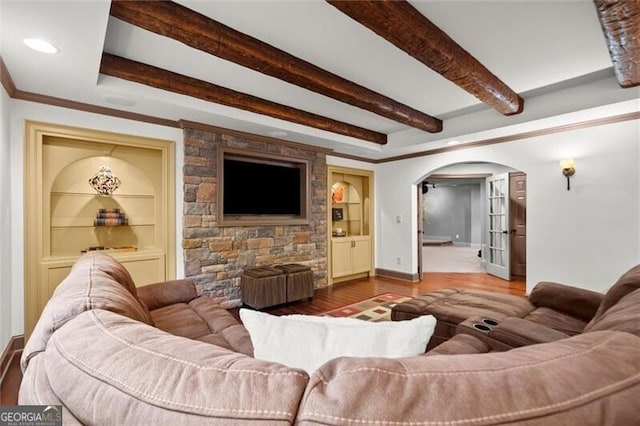 1860 Hill Chase, Alpharetta, GA 30022 - living area featuring arched walkways, wood finished floors, built in shelves, baseboards, and beamed ceiling