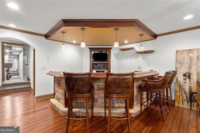 1860 Hill Chase, Alpharetta, GA 30022 - indoor wet bar featuring ornamental molding, wood-type flooring, arched walkways, hanging light fixtures, and recessed lighting