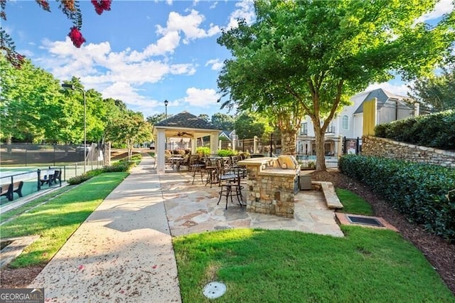 1860 Hill Chase, Alpharetta, GA 30022 - view of patio featuring a ceiling fan, a bar, and exterior kitchen