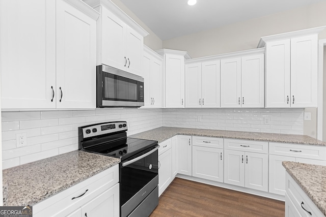 488 Nandina Ct, Warner Robins, GA 31088 - kitchen with stainless steel appliances, white cabinetry, backsplash, dark wood-style flooring, and light stone counters