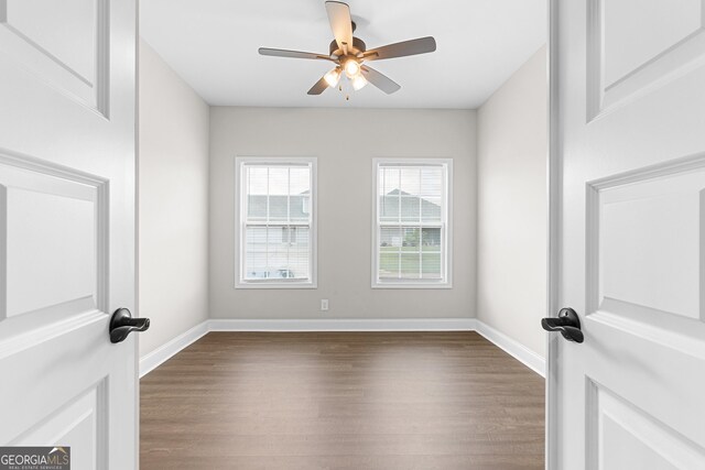 488 Nandina Ct, Warner Robins, GA 31088 - unfurnished room with dark wood-style floors and a ceiling fan