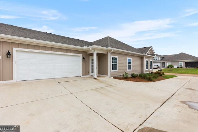 488 Nandina Ct, Warner Robins, GA 31088 - single story home featuring concrete driveway, board and batten siding, an attached garage, and a shingled roof
