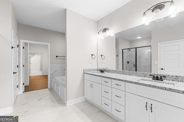 488 Nandina Ct, Warner Robins, GA 31088 - full bath with marble look tiles, double vanity, a stall shower, and a garden tub