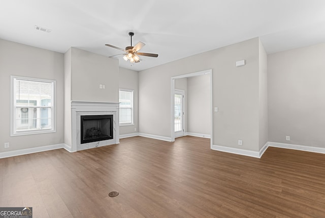 488 Nandina Ct, Warner Robins, GA 31088 - unfurnished living room with a ceiling fan, wood finished floors, and a fireplace