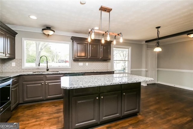 5798 Salem Rd, Covington, GA 30016 - kitchen featuring a sink, stainless steel electric range oven, ornamental molding, backsplash, and light stone counters