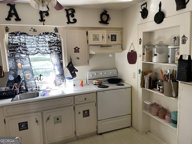 174 S Brunswick St, Jesup, GA 31546 - kitchen featuring white range with electric stovetop, extractor fan, light countertops, white cabinetry, and a sink