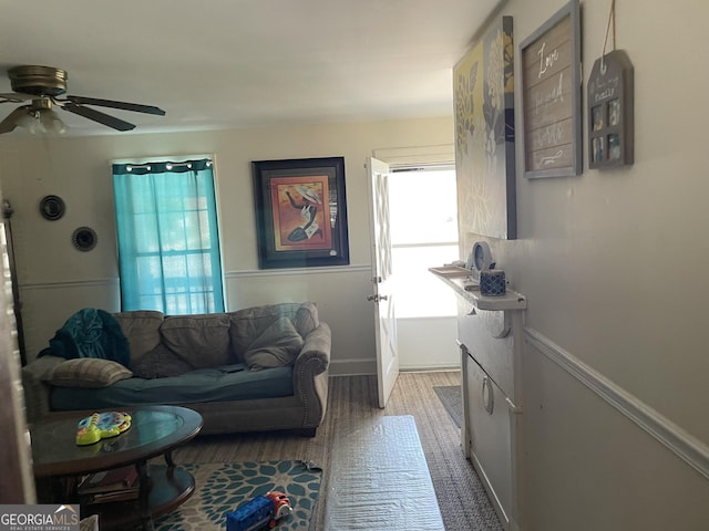 174 S Brunswick St, Jesup, GA 31546 - living room with ceiling fan, light wood-style flooring, and baseboards