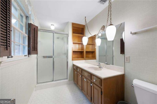 3589 Stone Ridge Trl, Douglasville, GA 30134 - bathroom featuring vanity, a shower stall, plenty of natural light, and tile patterned flooring