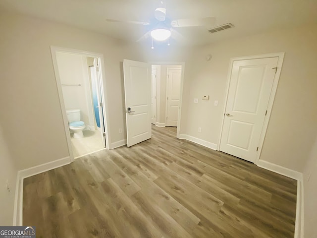 241 Perimeter Walk, Atlanta, GA 30338 - unfurnished bedroom featuring wood finished floors, ensuite bathroom, baseboards, and ceiling fan