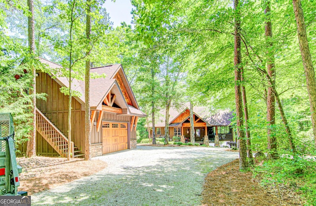 496 Cedar Valley Dr, Wedowee, AL 36278 - rustic home featuring roof with shingles, a garage, and a porch