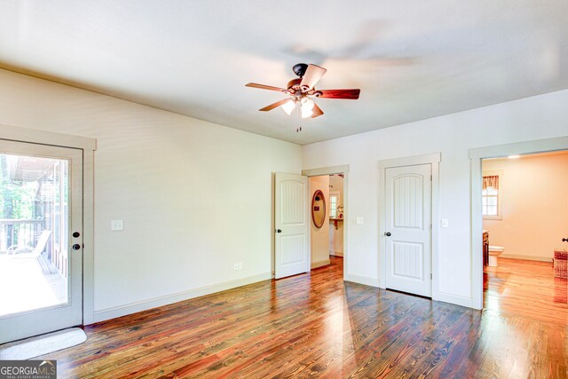 496 Cedar Valley Dr, Wedowee, AL 36278 - unfurnished bedroom featuring multiple windows, wood finished floors, access to outside, and ceiling fan