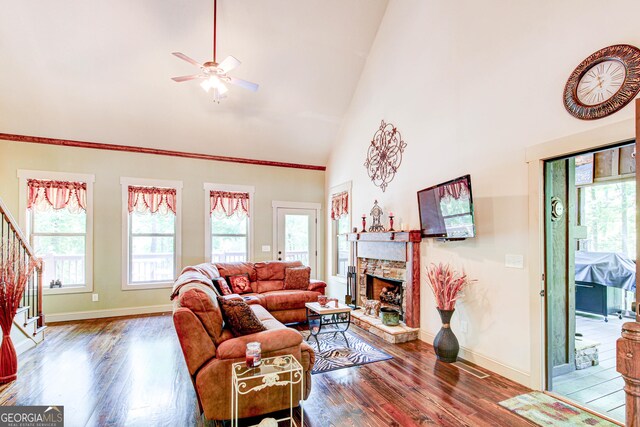 496 Cedar Valley Dr, Wedowee, AL 36278 - living area with plenty of natural light, stairway, wood finished floors, and high vaulted ceiling