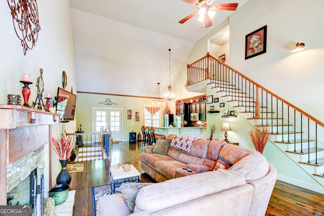 496 Cedar Valley Dr, Wedowee, AL 36278 - living area with high vaulted ceiling, wood finished floors, ceiling fan, a chandelier, and a fireplace