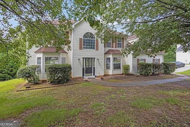 3885 Riverview Chase Blf, Ellenwood, GA 30294 - traditional-style home featuring a front lawn