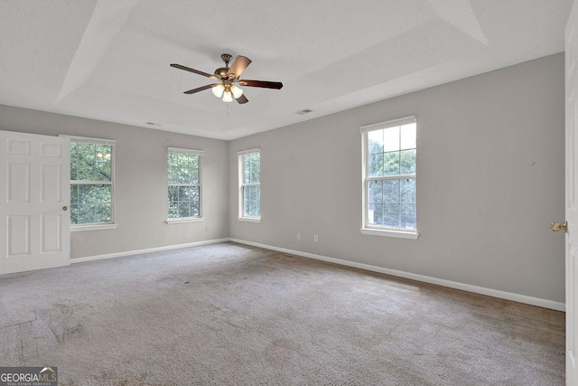3885 Riverview Chase Blf, Ellenwood, GA 30294 - carpeted spare room with a tray ceiling, baseboards, and ceiling fan