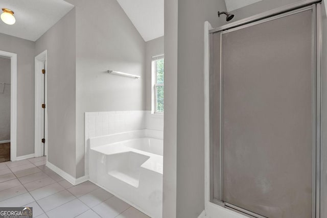 3885 Riverview Chase Blf, Ellenwood, GA 30294 - bathroom featuring tile patterned flooring, a stall shower, a bath, baseboards, and lofted ceiling