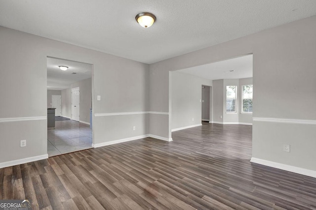 3885 Riverview Chase Blf, Ellenwood, GA 30294 - unfurnished room with dark wood finished floors and baseboards