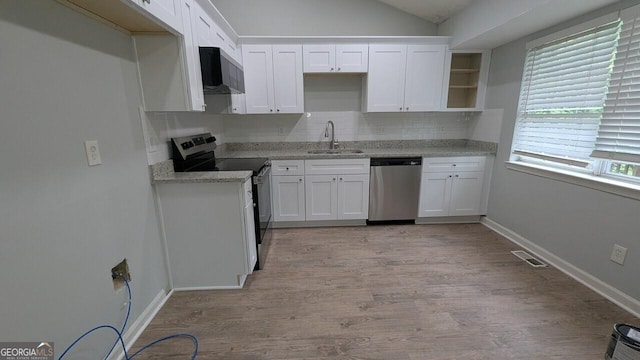 5710 Cardigan Trce, Sugar Hill, GA 30518 - kitchen with stainless steel appliances, a sink, backsplash, white cabinets, and lofted ceiling
