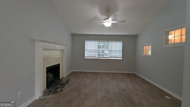 5710 Cardigan Trce, Sugar Hill, GA 30518 - unfurnished living room with wood finished floors, vaulted ceiling, ceiling fan, a fireplace, and baseboards