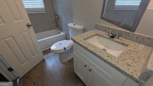 5710 Cardigan Trce, Sugar Hill, GA 30518 - full bathroom with vanity, wood finished floors, toilet, and bathing tub / shower combination