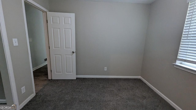5710 Cardigan Trce, Sugar Hill, GA 30518 - unfurnished room featuring dark colored carpet and baseboards